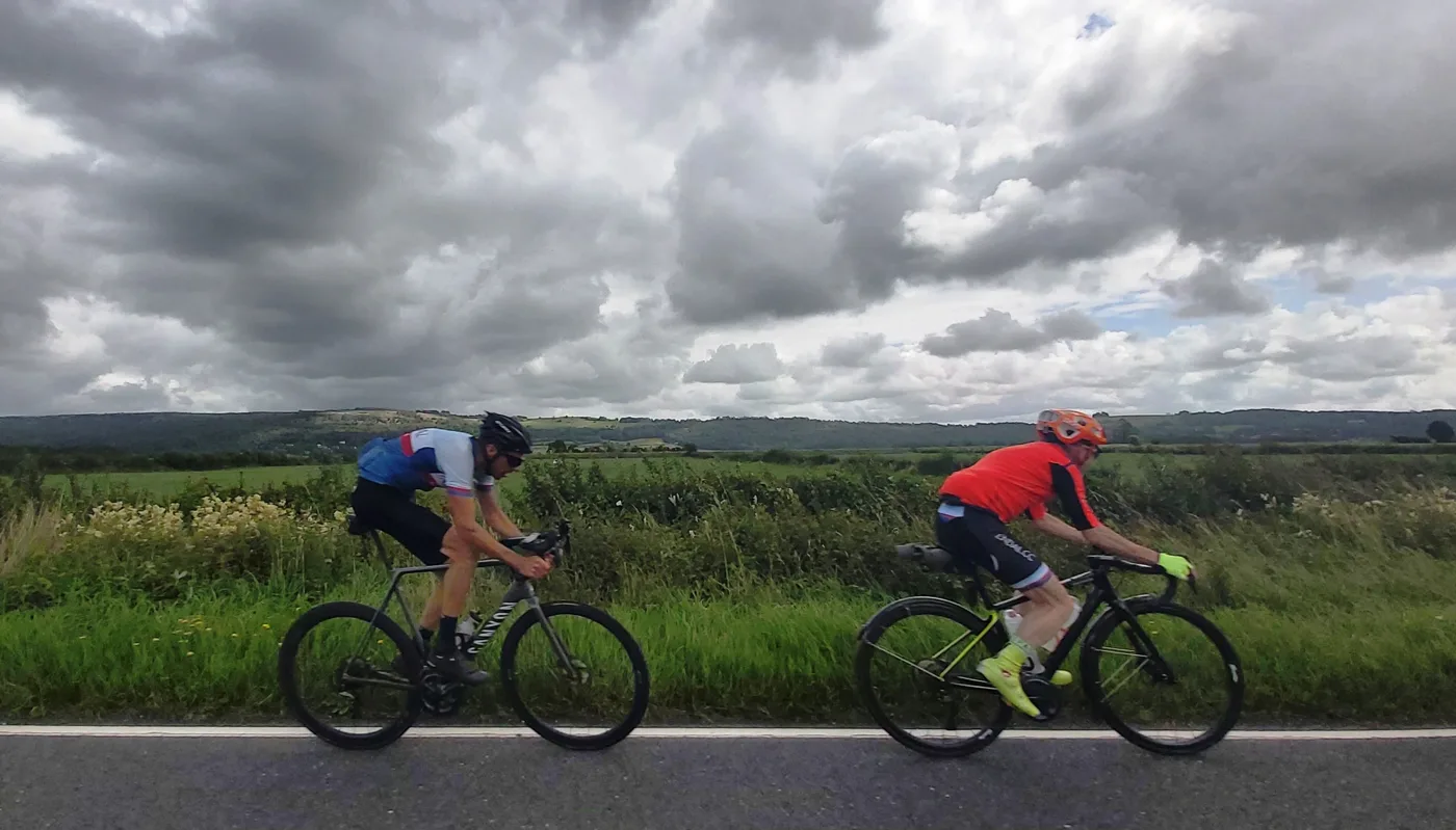 Cyclists on the Lyth Valley road. The A5074 through the valley is on the Stage 2 route between Bowness and the A590. The picture does not show the race.